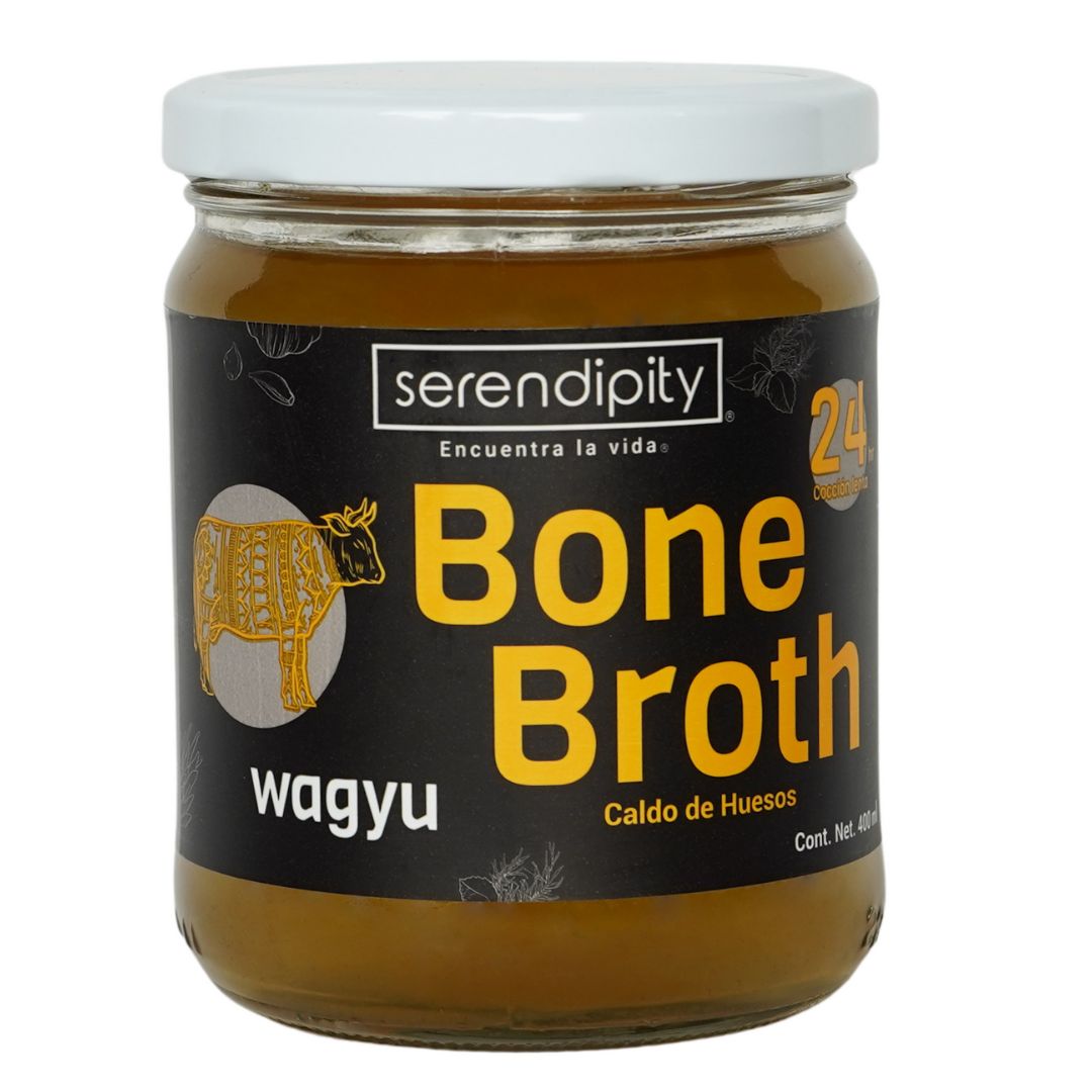 Frasco de caldo de huesos orgánico de wagyu Serendipity con etiqueta roja sobre fondo blanco, ideal para dietas keto y paleo.