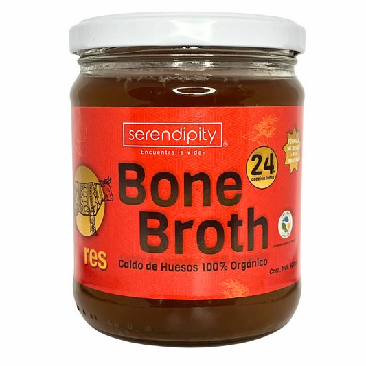 Frasco de caldo de huesos orgánico de res Serendipity con etiqueta roja sobre fondo blanco, ideal para dietas keto y paleo.